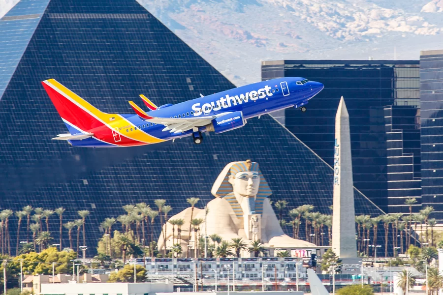 Southwest airplane in flight, evoking a sense of adventure and loyalty rewards.